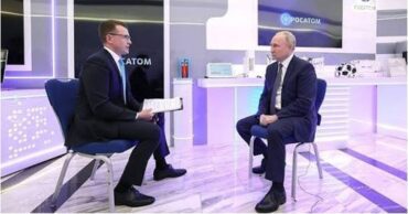 Pavel Zarubin y Vladimir Putin